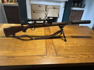 Remington .308 bolt action rifle and moderator